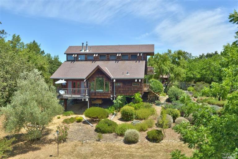 6949 Nolan Road Forestville, CA 95436 - Photo 1 of 1 Main house is a pole-frame, earthquake resistant design with massive exposed beams and timber. All utilities are underground, including PG&E, cable, internet and city water.