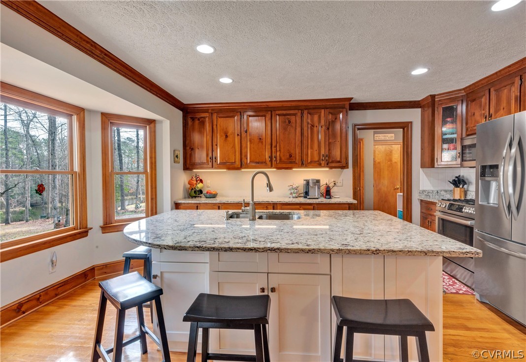 5511 Copperpenny Road Chesterfield, VA 23832 - Photo 8 of 35 a kitchen with a table chairs sink and cabinets