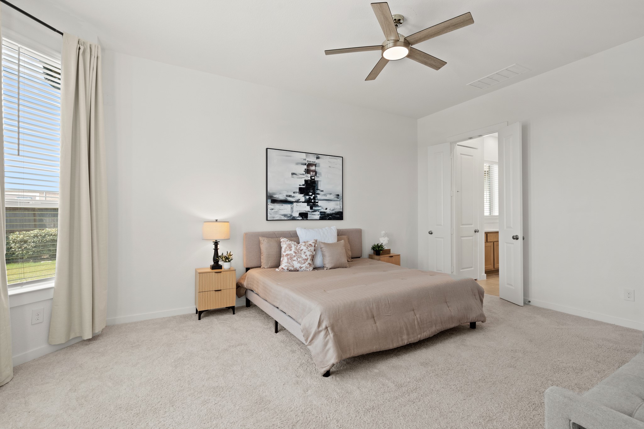 7303 Compass Drive Katy, TX 77493 - Photo 16 of 31 a bedroom with a bed and white walls