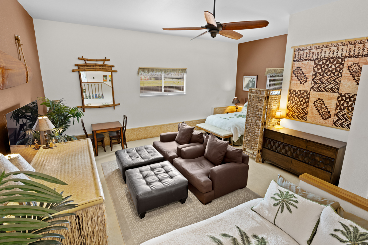 66-1685 Kohala Mountain Road Kamuela, HI 96743 - Photo 12 of 26 a living room with furniture and a fireplace