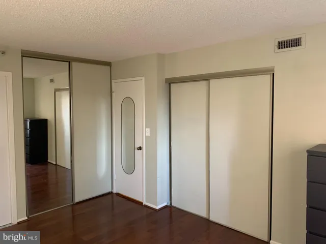 a kitchen with a refrigerator and a sink