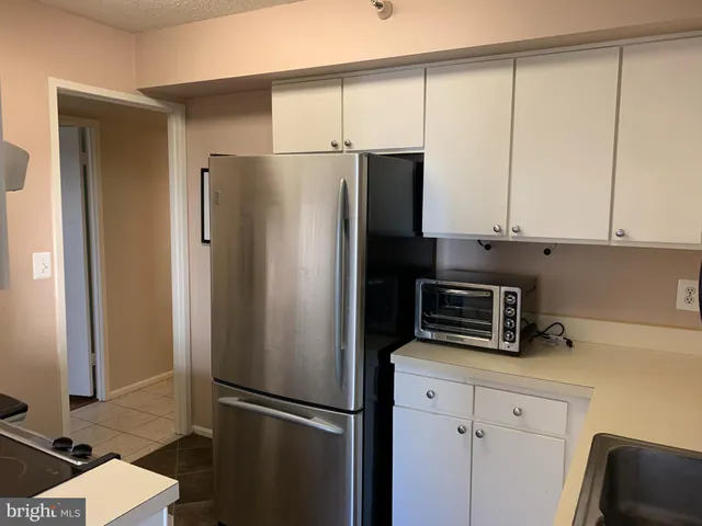 a kitchen with a stove and a microwave