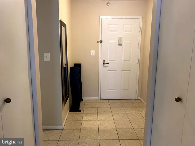 a view of a living room with hardwood floor