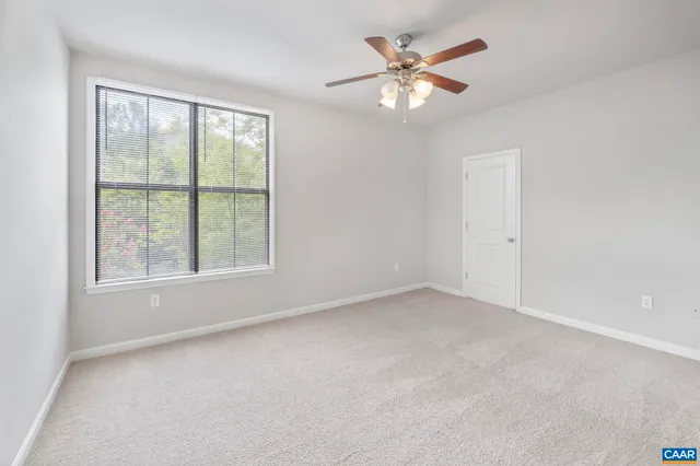 a bathroom with a granite countertop sink a toilet and bathtub