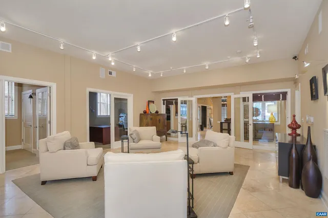 a kitchen with stainless steel appliances kitchen island granite countertop a refrigerator and microwave