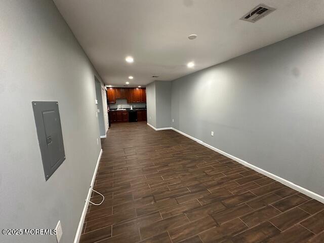 216 Ocean Gate Avenue, Unit 2 Ocean Gate, NJ 08740 - Photo 2 of 17 an empty room with wooden floor and windows