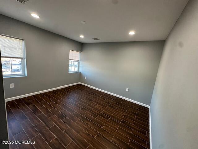 216 Ocean Gate Avenue, Unit 2 Ocean Gate, NJ 08740 - Photo 8 of 17 a view of room with window and wooden floor