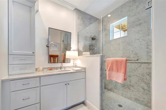 a view of a bedroom with wooden bench and bench