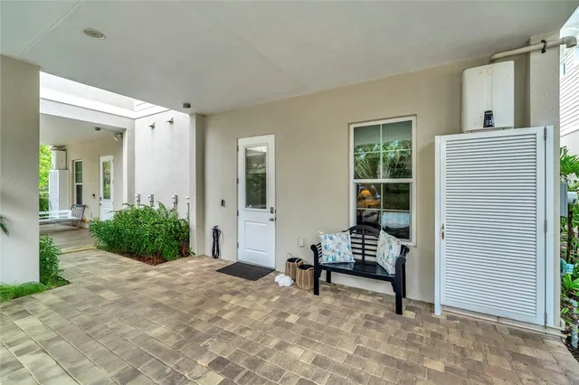 an aerial view of a house with garden space and street view