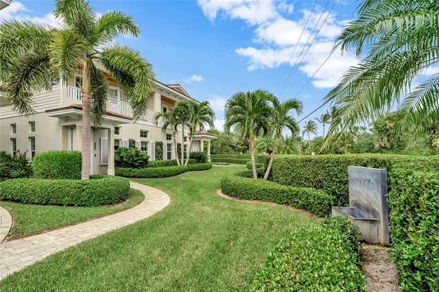 a living room with fireplace furniture and a wooden floor