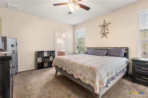 a bedroom with bed and window