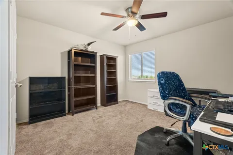 a view of workspace with furniture and natural light