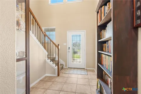 a view of an entryway with wooden floor