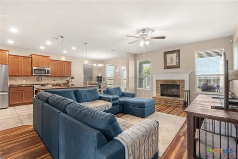 a living room with furniture and a fireplace