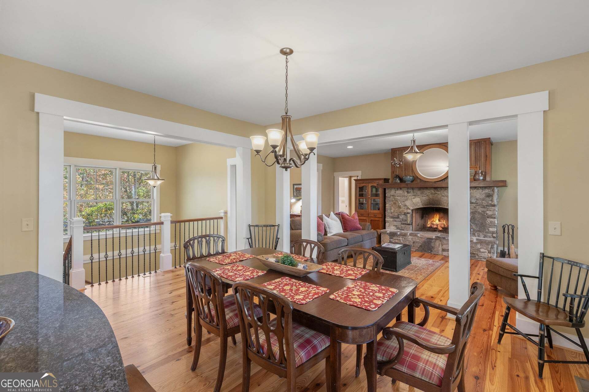 2473 Highland Gap Road Scaly Mountain, NC 28775 - Photo 15 of 93 a view of a dining room and livingroom with furniture wooden floor a chandelier