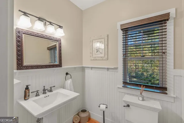 a bedroom with furniture and a flat screen tv