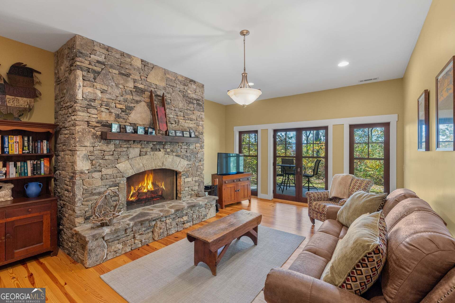 2473 Highland Gap Road Scaly Mountain, NC 28775 - Photo 58 of 93 a living room with furniture and a fireplace