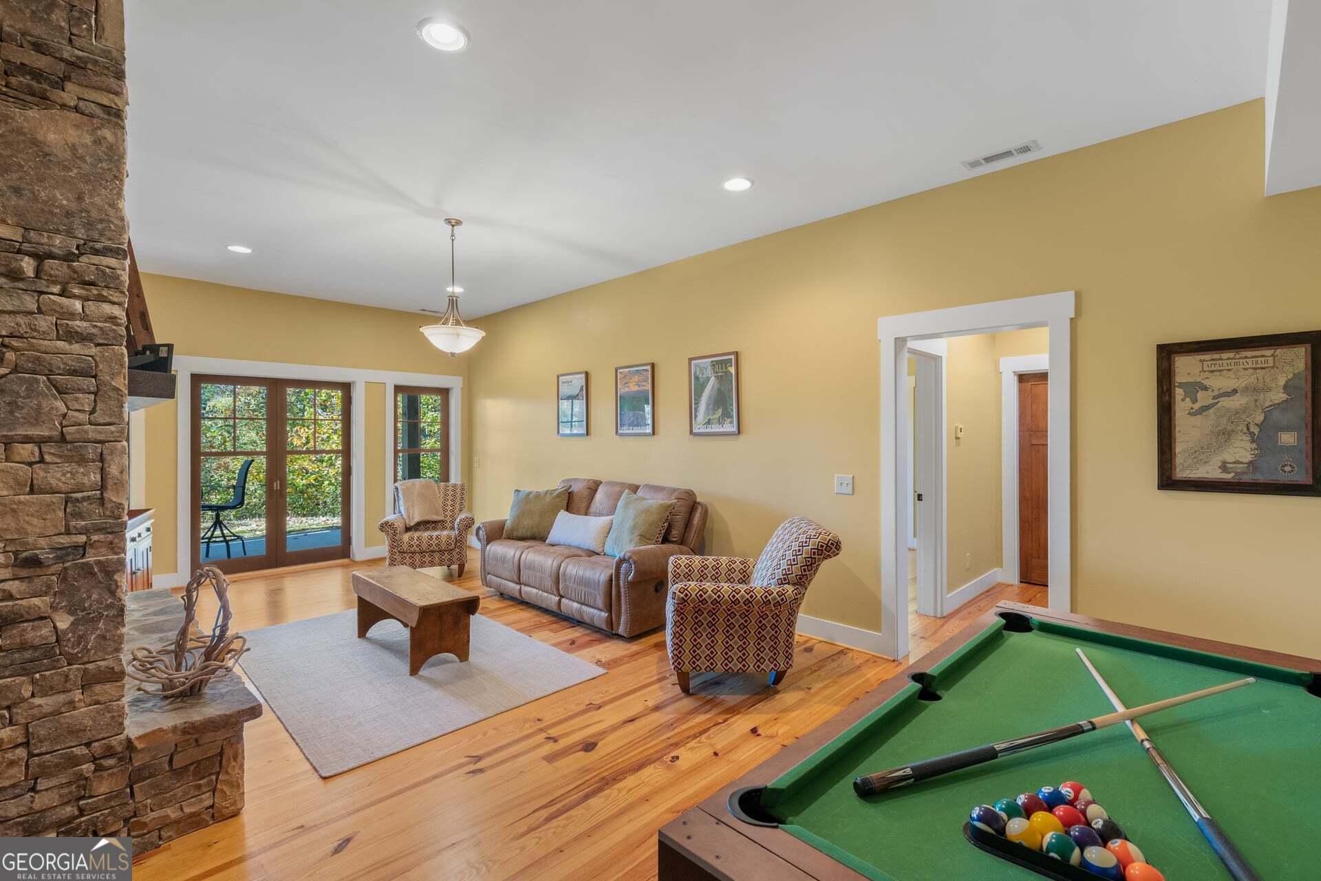 2473 Highland Gap Road Scaly Mountain, NC 28775 - Photo 60 of 93 a living room with furniture and a wooden floor