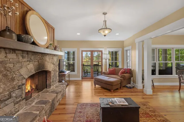 a view of a hallway view with wooden floor and staircase