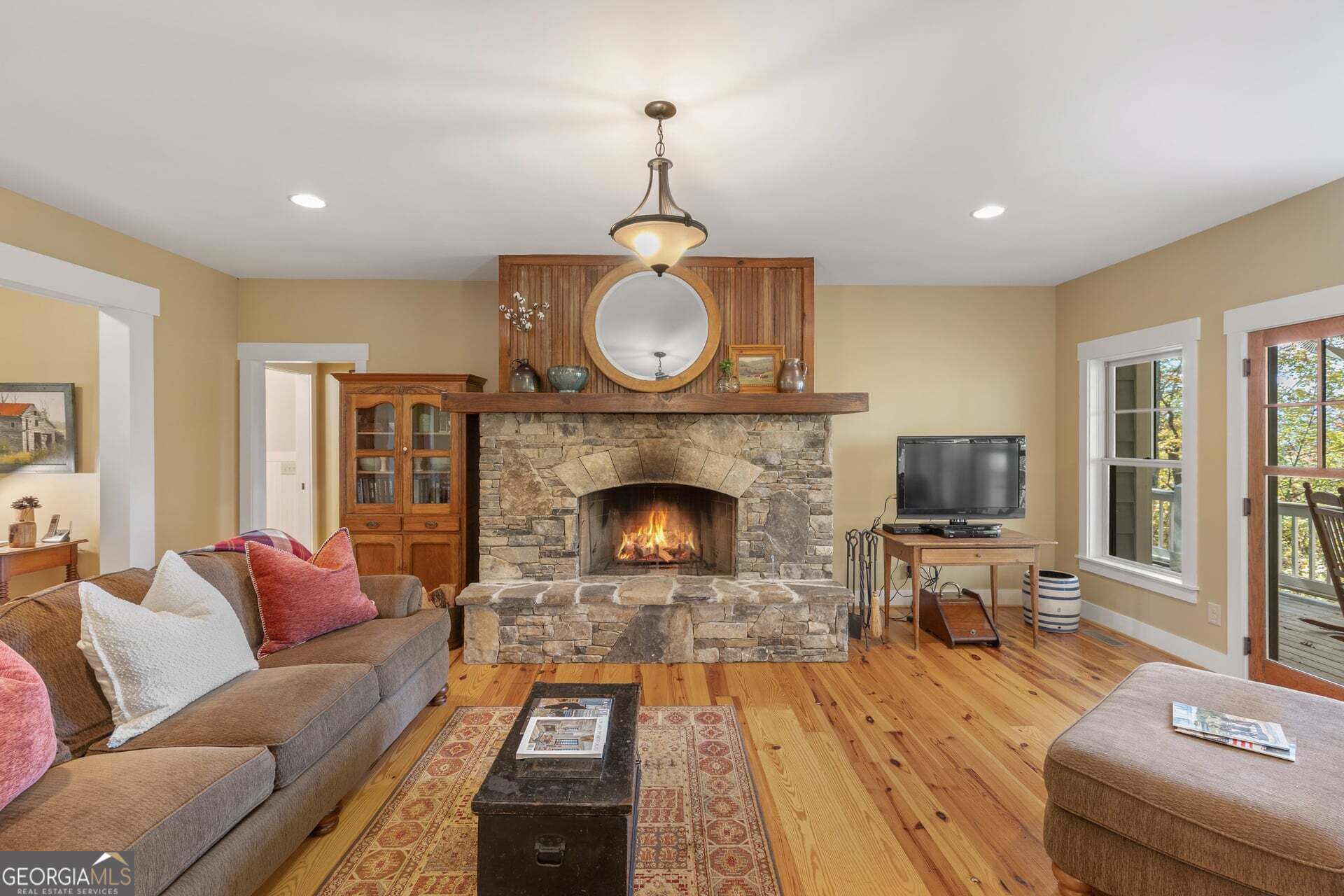 2473 Highland Gap Road Scaly Mountain, NC 28775 - Photo 9 of 93 a living room with furniture a fireplace and a flat screen tv