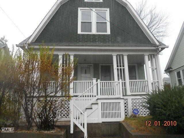 230 Meriden Road Waterbury, CT 06705 - Photo 1 of 1 a front view of a house with a garden