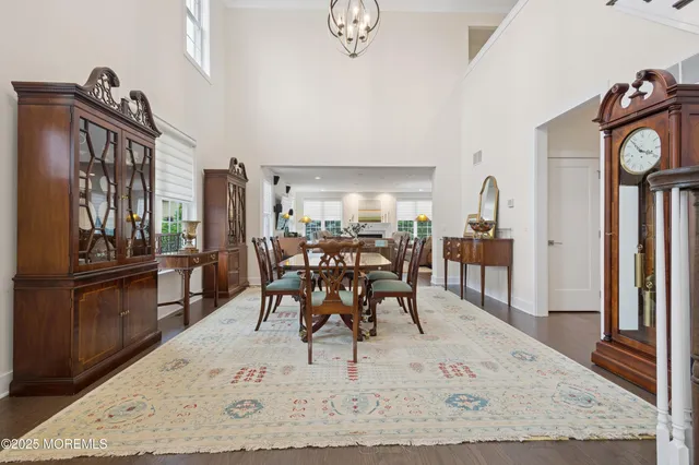 a view of a dining room with furniture and a rug