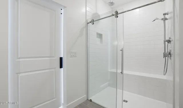 a bathroom with double sink and a mirror