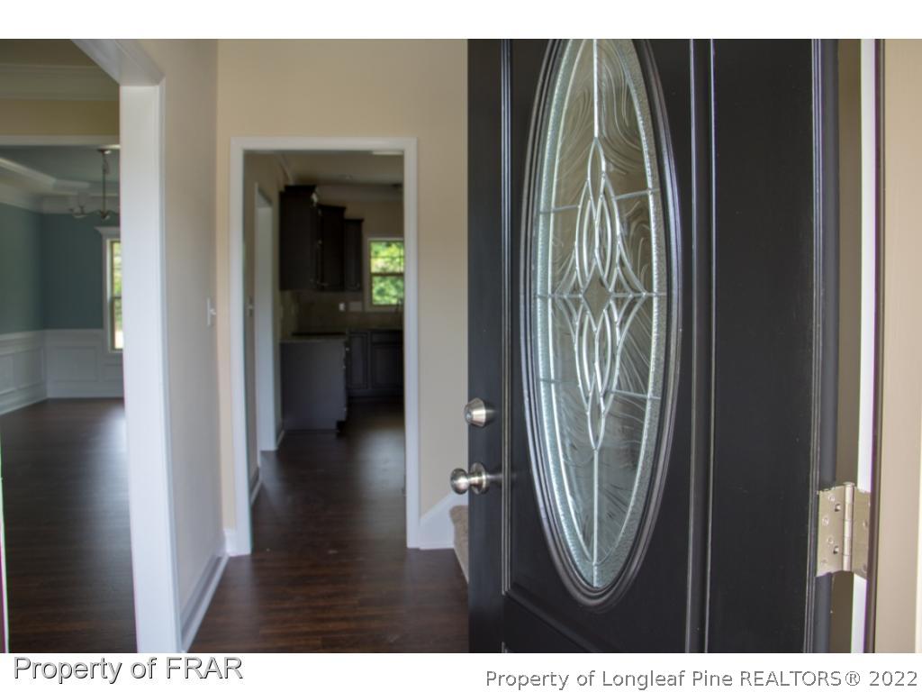 5219 Sunset View Road Hope Mills, NC 28348 - Photo 4 of 24 a view of a hallway with wooden floor