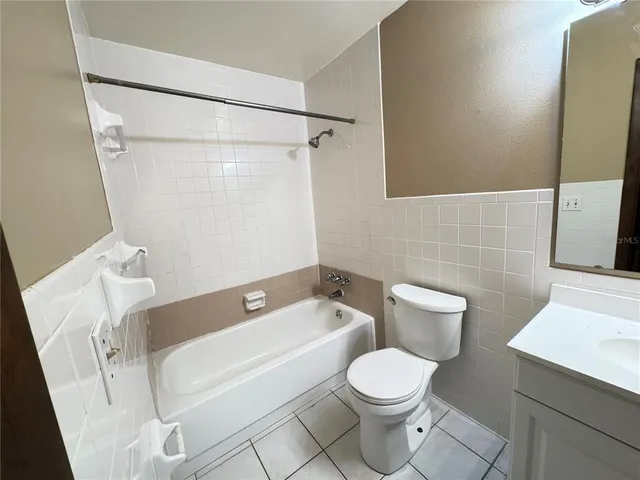 a bathroom with a toilet and a bathtub