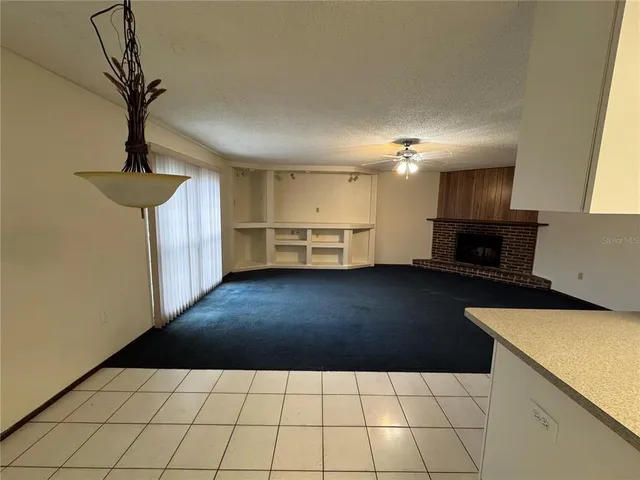 a kitchen with a sink a stove top oven and cabinets