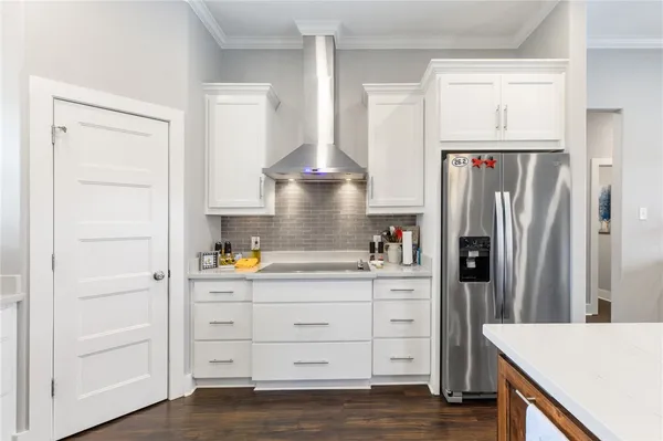 a kitchen with stainless steel appliances a refrigerator and a stove