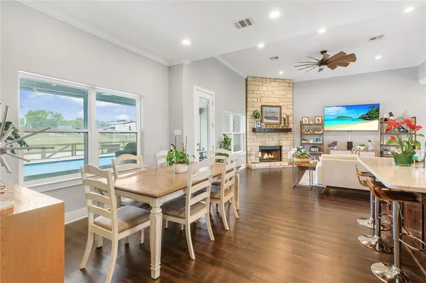a view of a dining room with furniture window and wooden floor