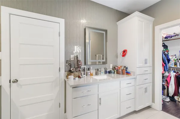 a view of bathroom with dual sinks