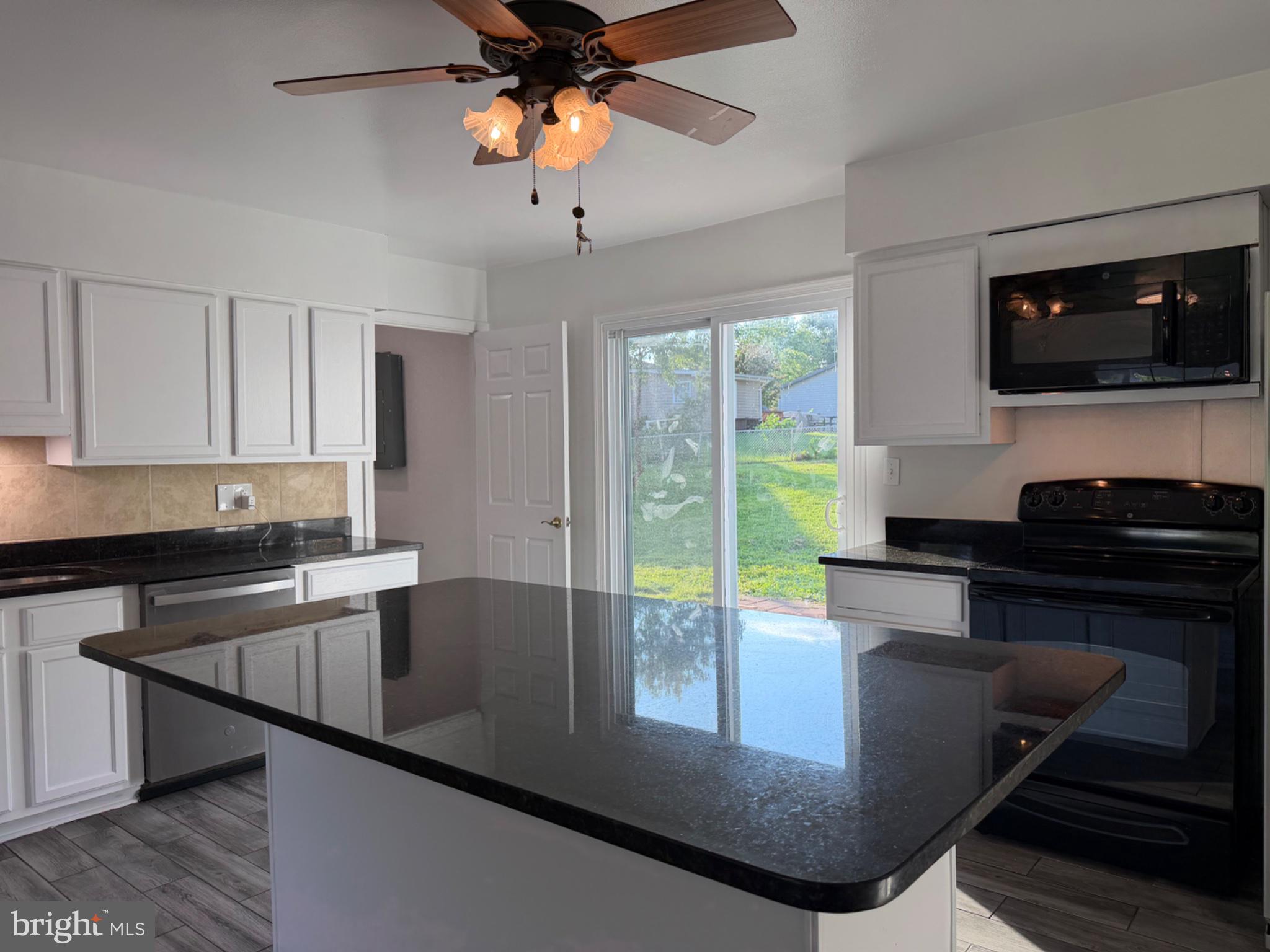 606 West Beech Road Sterling, VA 20164 - Photo 12 of 33 Updated kitchen with white painted cabinets.