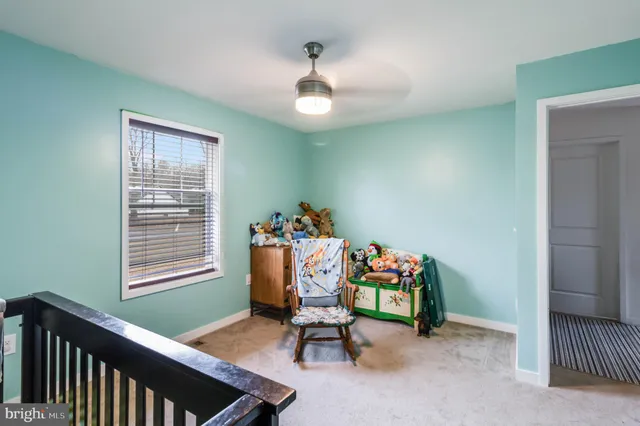 a view of a livingroom and a hallway