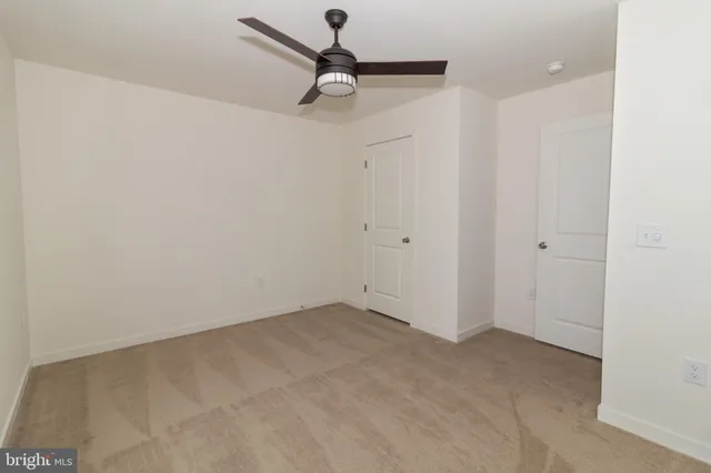 a view of walk in closet with wooden floor