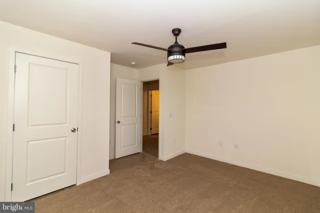 a kitchen with stainless steel appliances granite countertop a refrigerator a sink dishwasher a stove with wooden cabinets and floors