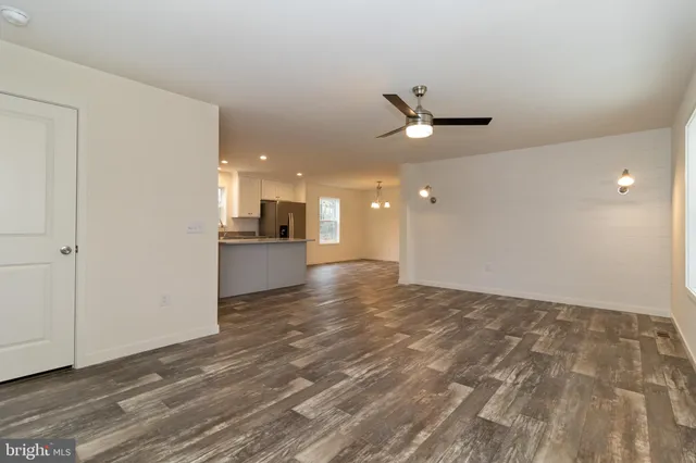 a front view of house with yard and trees