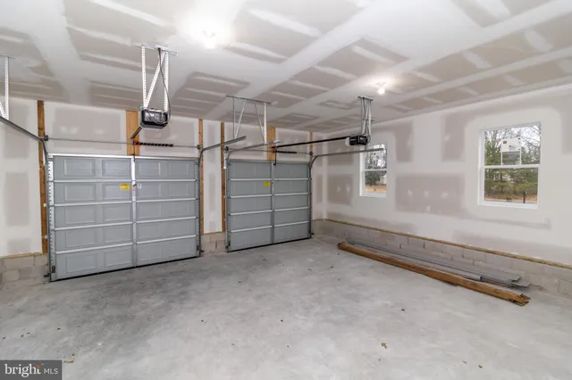 a sign board with a building in the background