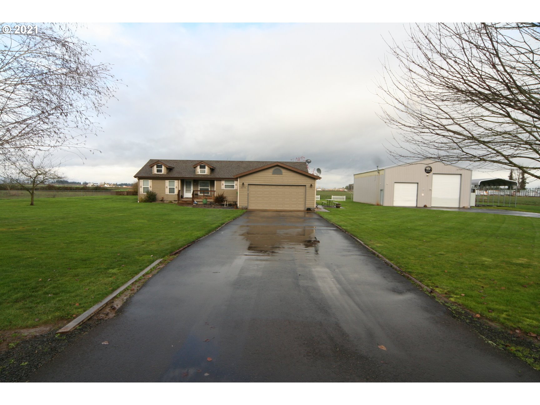 16775 Southeast Fairview Road Dayton, OR 97114 - Photo 1 of 24 a view of a street with a big yard and large trees
