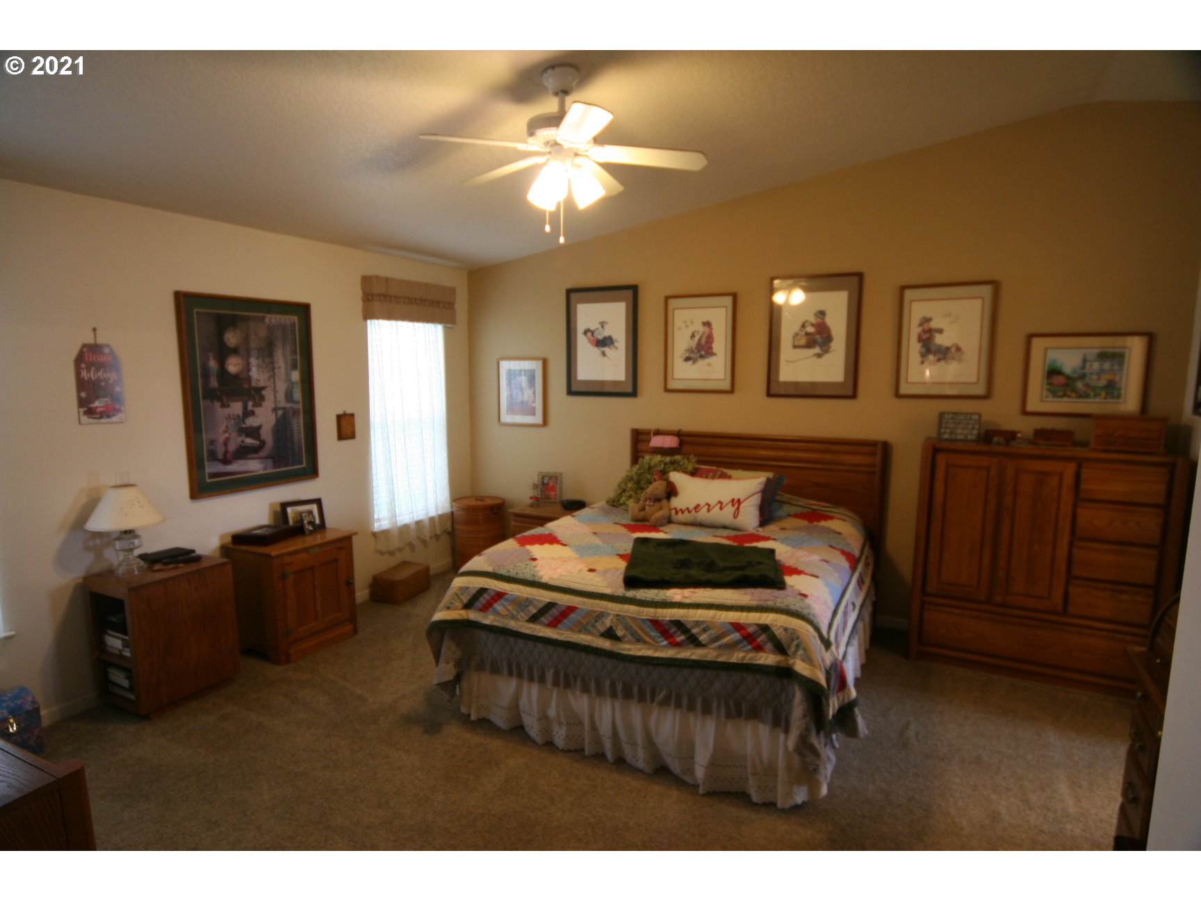 16775 Southeast Fairview Road Dayton, OR 97114 - Photo 13 of 24 a bedroom with furniture and a chandelier