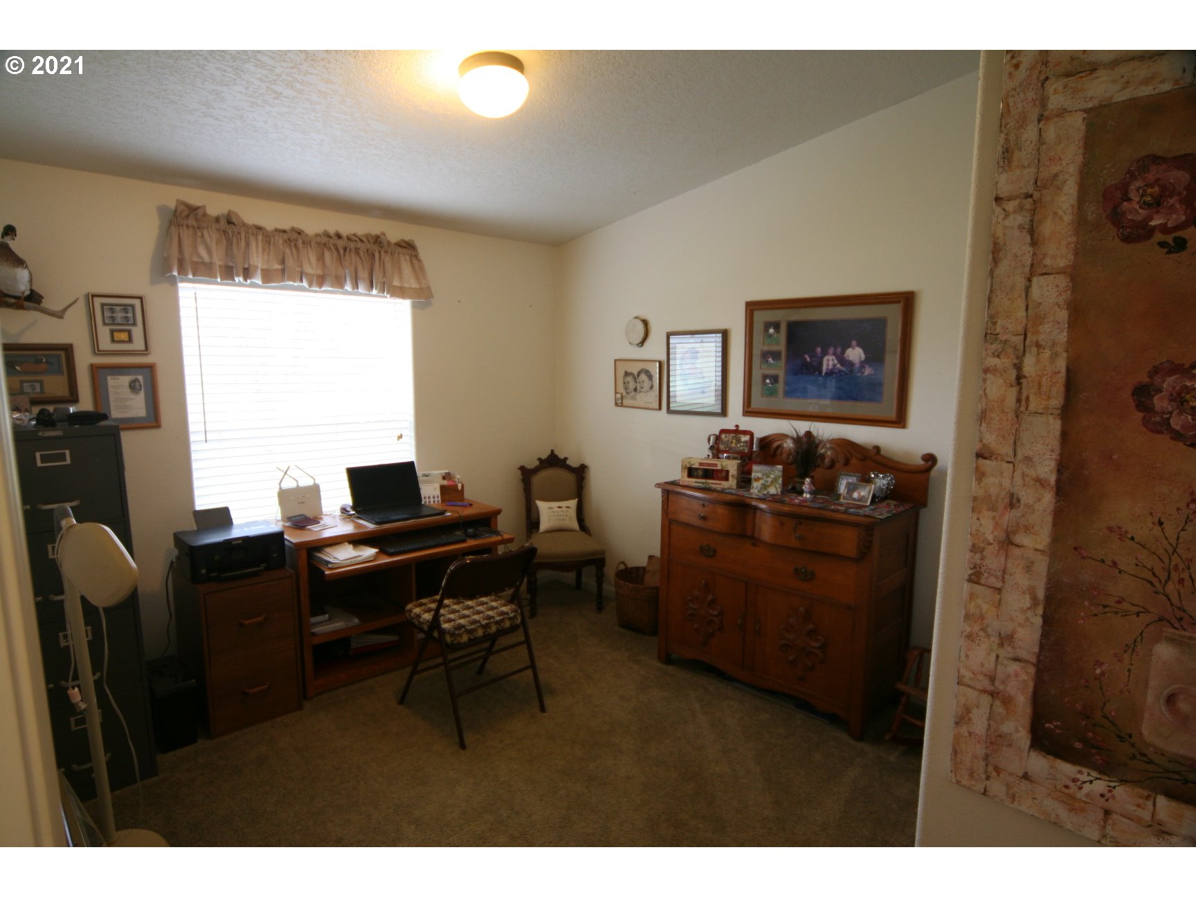 16775 Southeast Fairview Road Dayton, OR 97114 - Photo 17 of 24 a view of a workspace with furniture and a window