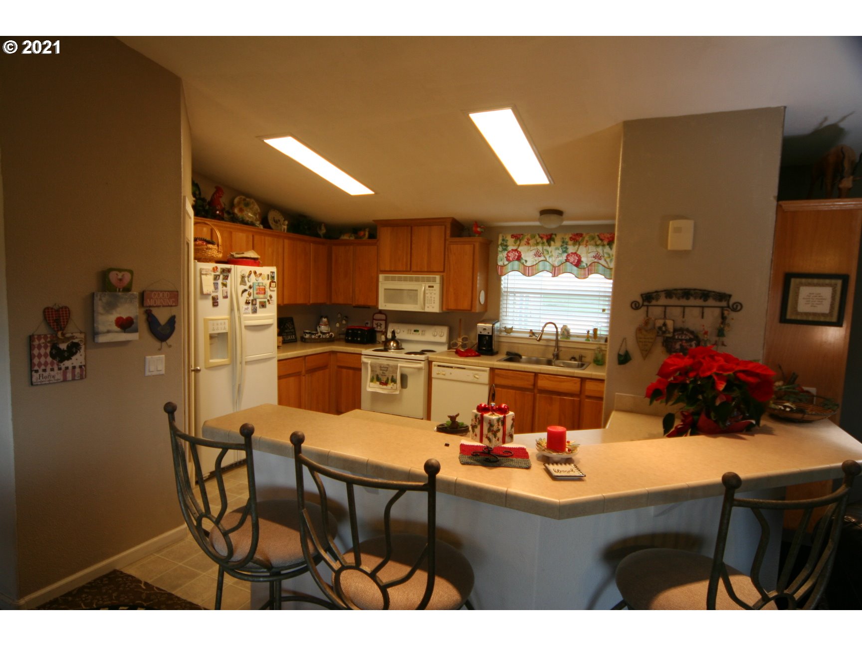 16775 Southeast Fairview Road Dayton, OR 97114 - Photo 4 of 24 a kitchen with stainless steel appliances kitchen island granite countertop a sink and cabinets