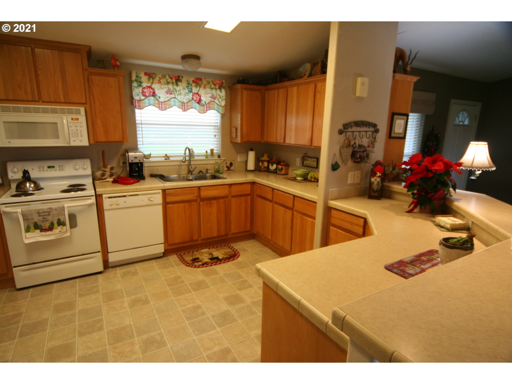 16775 Southeast Fairview Road Dayton, OR 97114 - Photo 5 of 24 a kitchen with a sink a stove and cabinets