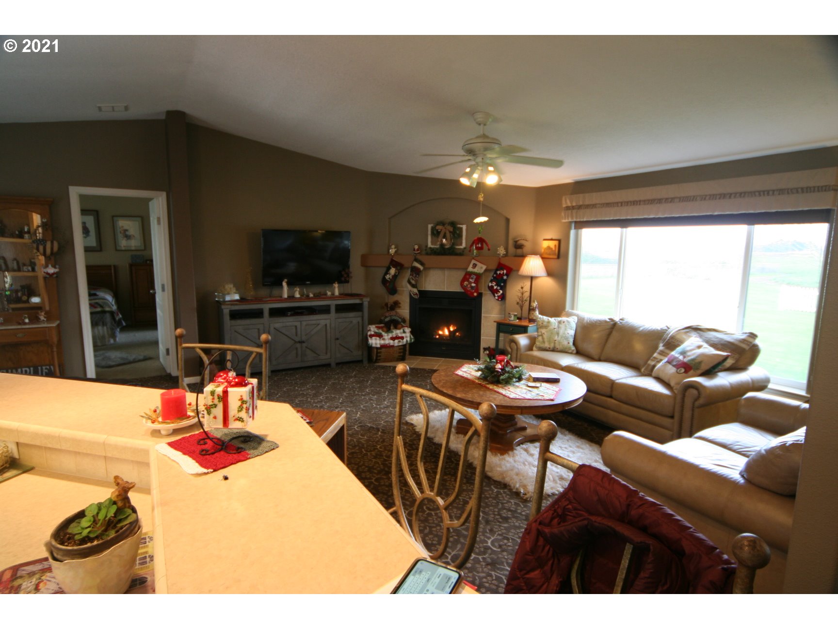 16775 Southeast Fairview Road Dayton, OR 97114 - Photo 7 of 24 a living room with fireplace furniture and a flat screen tv