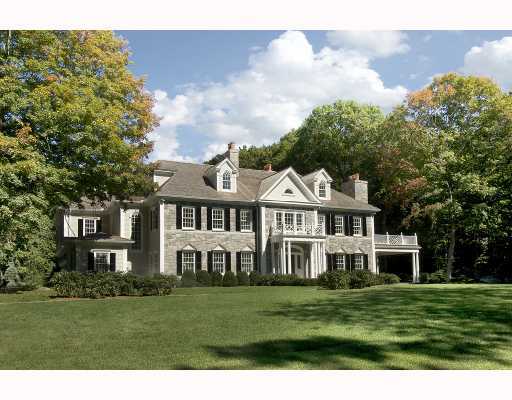 Undisclosed Address Greenwich, CT 06830 - Photo 1 of 1 a front view of a house with a garden