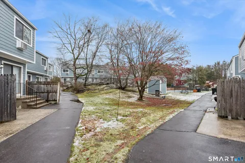 a view of yard with swimming pool and sitting area