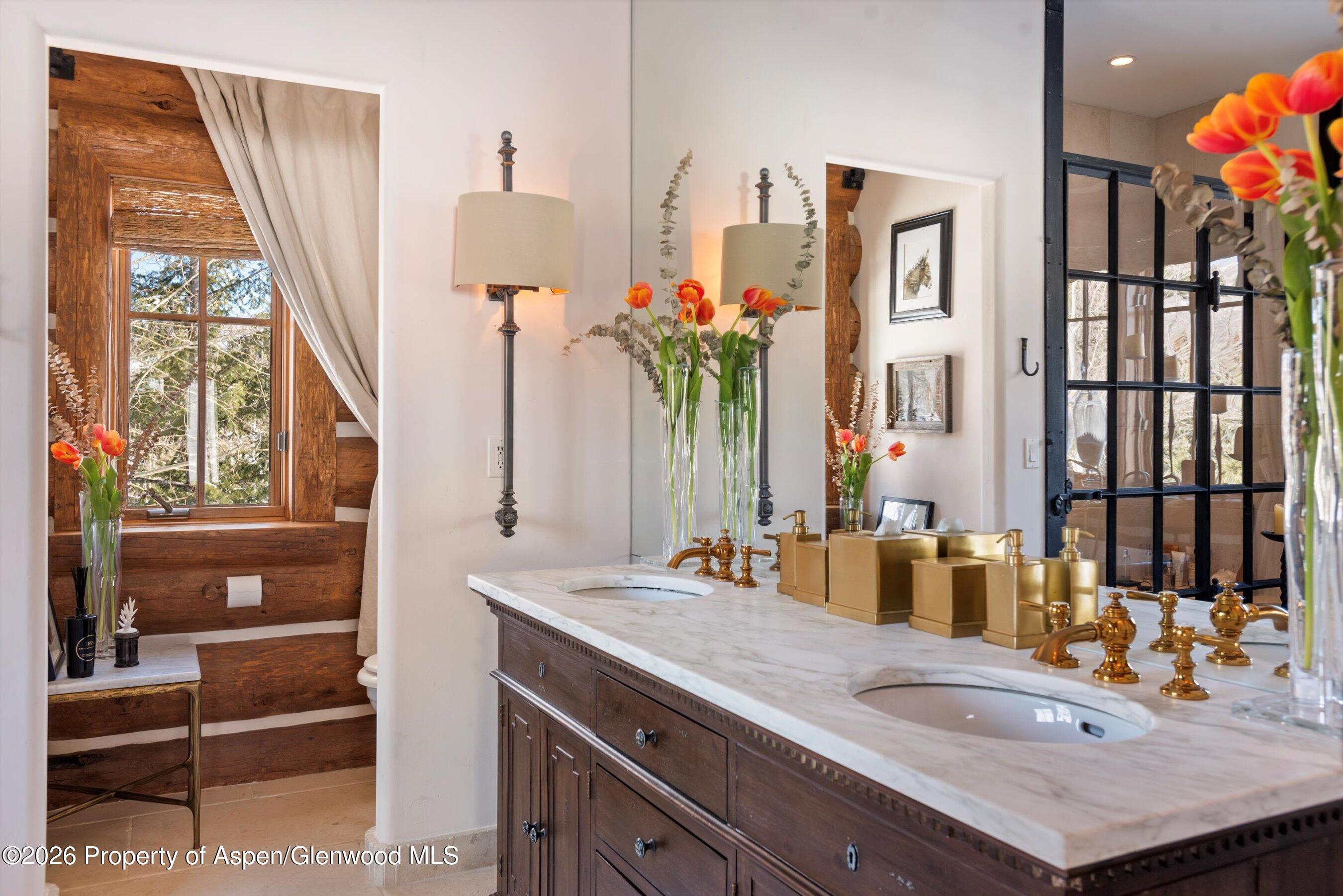 6855 Capitol Creek Road Snowmass, CO 81654 - Photo 19 of 79 a bathroom with a sink double vanity and a mirror