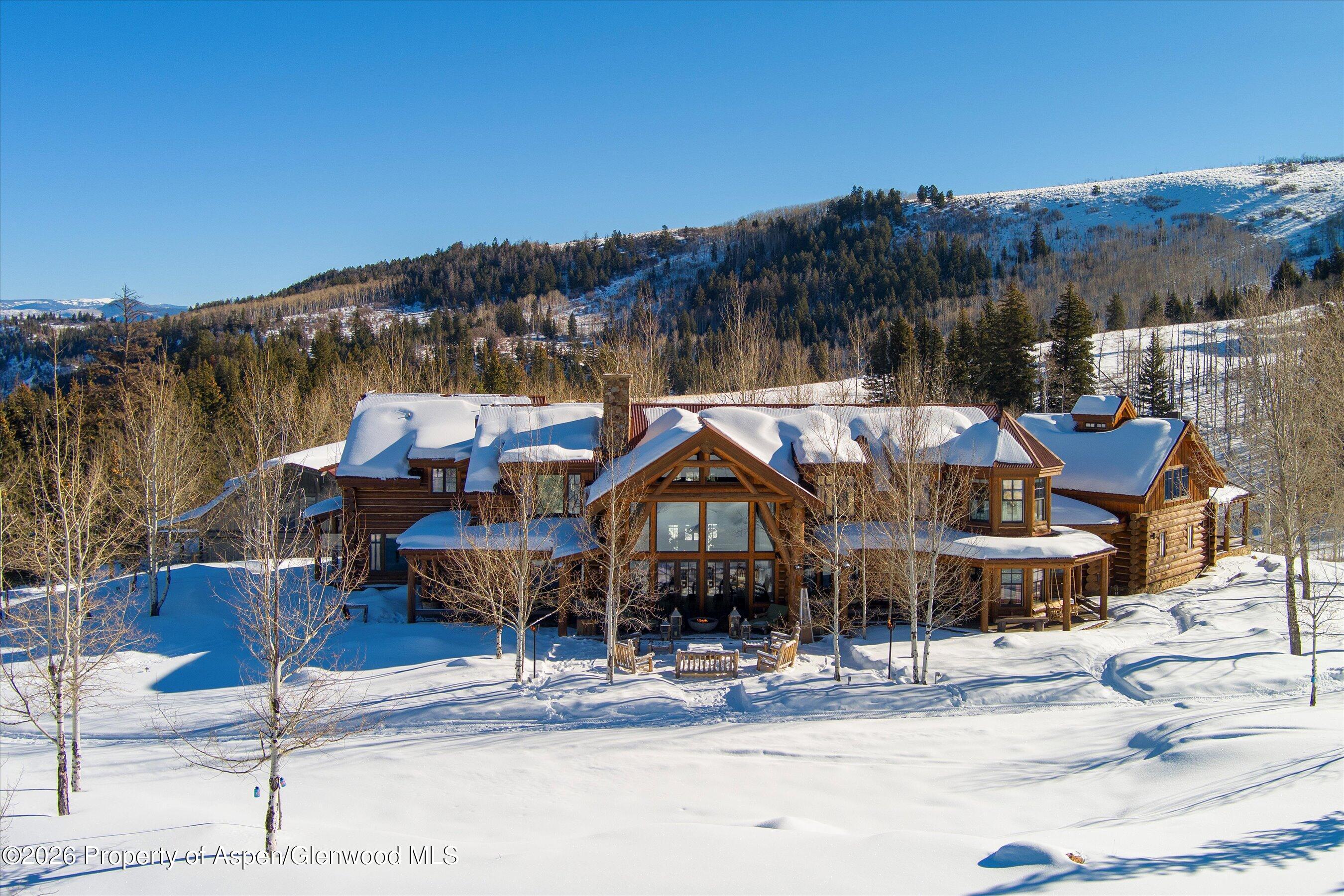 6855 Capitol Creek Road Snowmass, CO 81654 - Photo 2 of 79 a view of a town with barn and large trees