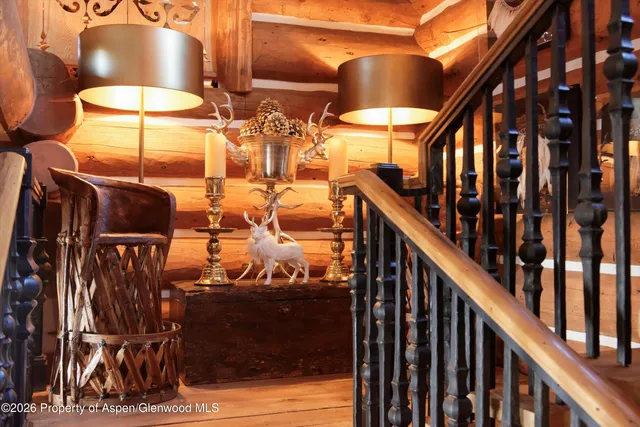 a bedroom with furniture and a large window